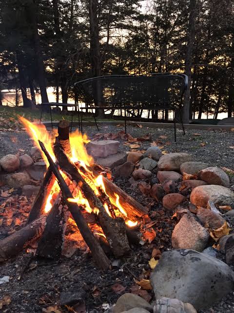 Lakeside fire at dusk
